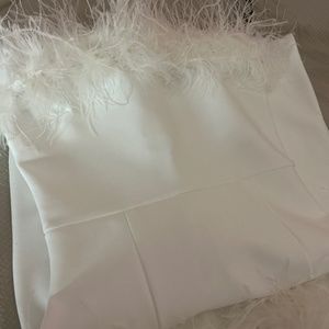 Beautiful and elegant white feathered dress